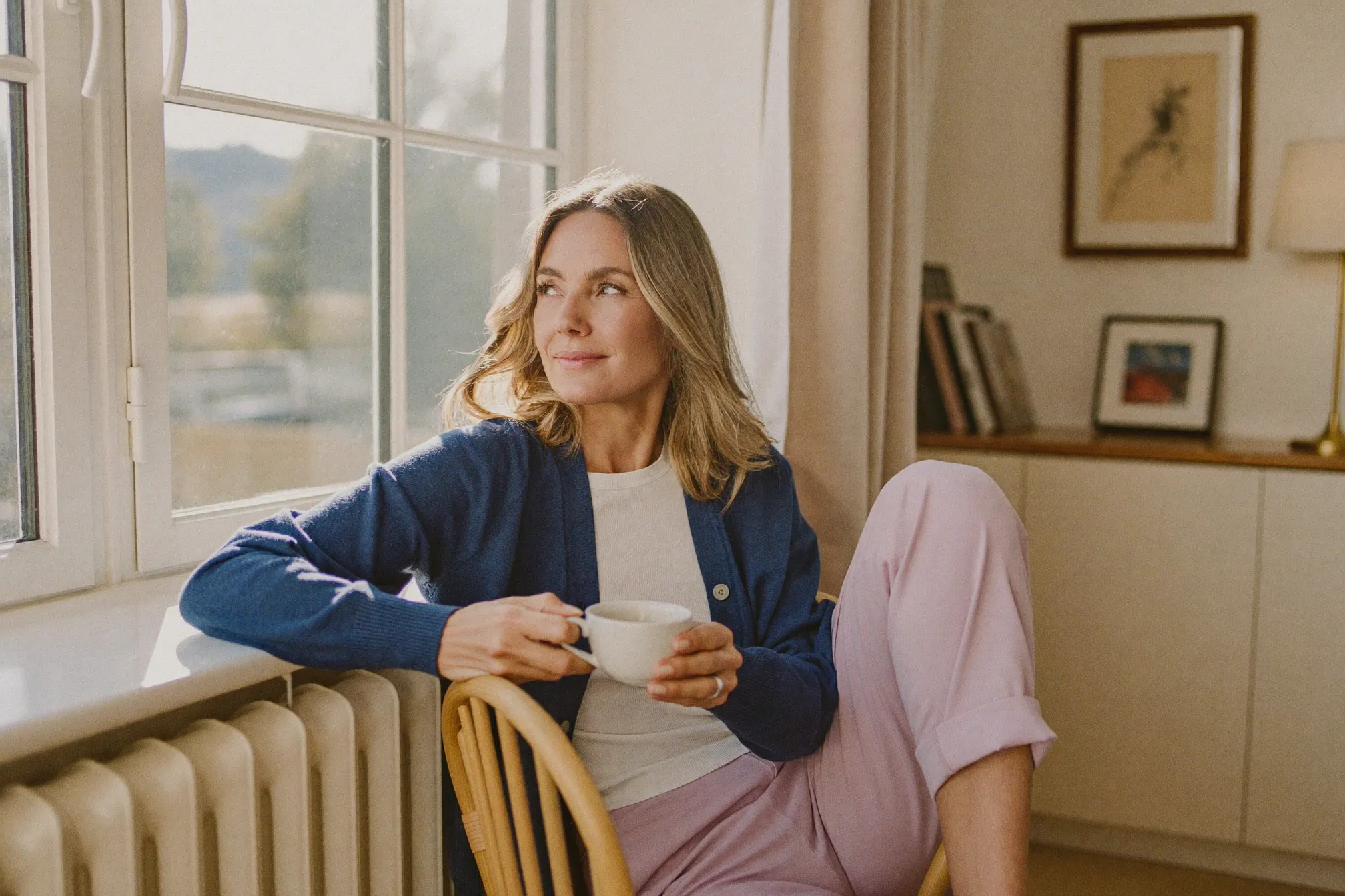 Calm woman in her 50s relaxing at home, illustrating overactive bladder and urgency after menopause